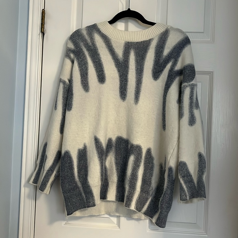 Verge Girl sweater with graffiti design